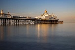 Eastbourne pier in England seen at sunset. Photograph by George ...