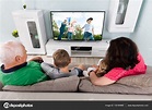 Family With Kids Watching Movie Stock Photo by ©AndreyPopov 132160866