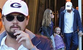 Leonardo DiCaprio takes on daddy duties as he holds hands with Tobey ...
