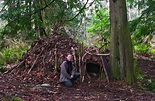 How to Build a Survival Shelter - Sleeping outside in a primitive ...