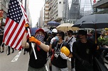 The Latest: Hong Kong protesters surround police station