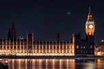 the houses of parliament and big ben in london lit up on an evening ...