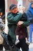 Rupert Grint carries his daughter Wednesday during a stroll in New York ...