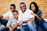 "A Beautiful African American Family Sitting Outside" by Stocksy Contributor "Kristen Curette ...