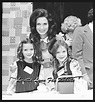 Loretta with her twin daughters when she won a woman of the year award ...