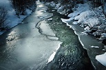 Dark winter scene with a frozen river 2177614 Stock Photo at Vecteezy