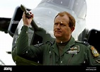 Station Commander Graham Wright stands alongsige a Jaguar fighter jet ...
