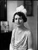 an old black and white photo of a woman in a wedding dress with pearls ...