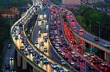 Traffic jam in the rush hour on highway. Cars on bridges and roads in ...