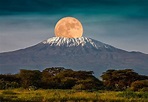 The full moon rises over Mount Kilimanjaro, Tanzania, Africa. February ...
