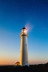 Lighthouse beneath the sky and stars with light on image - Free stock ...