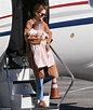 Riley Keough cradles her baby daughter as she flies back to LA after ...