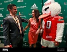 Manny Diaz, left, is congratulated by his wife, Stephanie, after a news ...