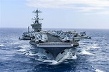 The aircraft carrier USS Harry S. Truman travels in the Atlantic Ocean ...