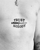 Trust nobody tattoo on the sternum - Tattoogrid.net