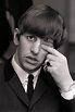 Ringo Starr, drummer with The Beatles pop group, rubs his eye with his ...