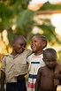 Happy African children embracing on street · Free Stock Photo
