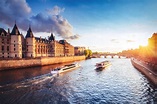 Dramatic sunset over river Seine in Paris, France, with Conciergerie ...