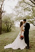 bride and groom kissing greenery | Wedding picture poses, Groom ...