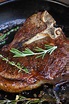 Perfectly seared Tbone steak in a cast iron skillet after being ...