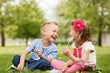 Little brother and sister enjoy lollipops and having fun in the – Fiber ...