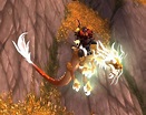Riendas del dragón nimbo dorado célico - Objeto - World of Warcraft