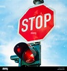 stop sign with red traffic light Stock Photo - Alamy