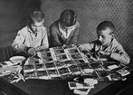 Children playing with stacks of hyperinflated currency during the ...
