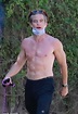 Shirtless Chris Pine showcases six-pack abs and bulging biceps while ...