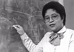An image of Dr. Euphemia Lofton Haynes standing by a blackboard. She ...