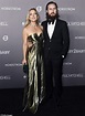 Kate Hudson glows in gold while partner Danny Fujikawa wears black tie ...