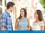 Three Friends Talking Taking a Conversation on the Street Stock Image ...