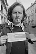 English rock musician Ric Grech holding up a parking ticket, Brook ...