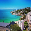 Oriental Bay, Wellington, New Zealand. Blue skies and blue waters of ...