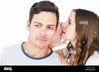 Young couple sharing a secret Stock Photo - Alamy