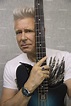 U2 Bass Guitarist Adam Clayton Strums Funky Blue Guitar, Color from ...