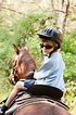 Little boy on horseback stock photo. Image of forest - 22490070
