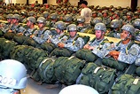 U.S. Army Airborne School students wait for their final inspection ...