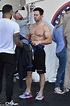 Mark Wahlberg reveals his chiseled abs and muscular biceps during a ...