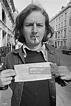 English rock musician Ric Grech holding up a parking ticket, Brook ...