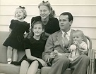 an old black and white photo of a family