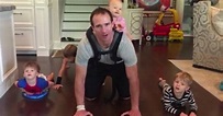 Drew Brees does pushups with daughter strapped to his back for fallen ...