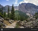 A trail leading through a rocky terrain in the Canadian Rocky Mountains ...