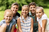 Group of happy kids or friends outdoors Stock Photo by ©Syda ...