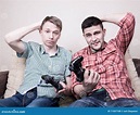 Two Guys Playing Video Games Stock Photo - Image of playing, confidence ...