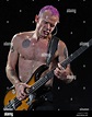 Flea, whose real name is Michael Peter Balzary, plays the bass guitar ...
