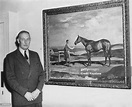 Sir Harold Augustus Wernher, 3rd Baronet Wernher with a painting of ...
