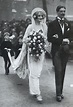 an old black and white photo of a bride and groom walking down the ...