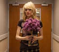 Emma Stone as Sam with flowers smirking - Birdman | Cultjer