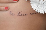 "Be here now" tattoo on the ribcage.